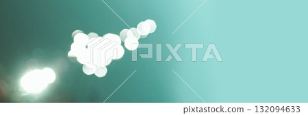 Abstract defocused white light bokeh against turquoise background with soft 132094633