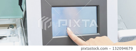 Close-up of caucasian female using touchscreen interface on technological 132094679