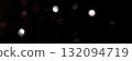 Abstract dark bokeh light pattern with soft, blurred orbs on black background 132094719