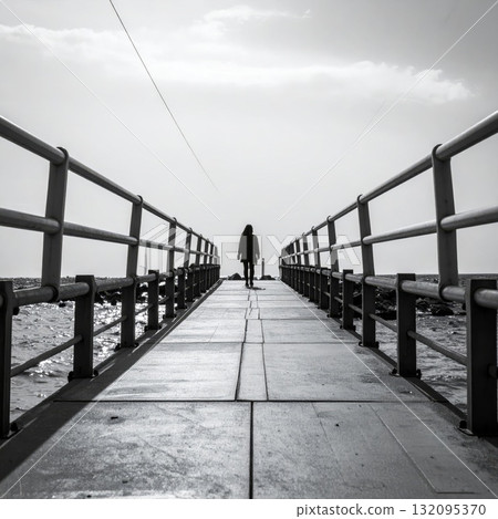 Woman on a long bridge or road, loneliness and meditation concept 132095370