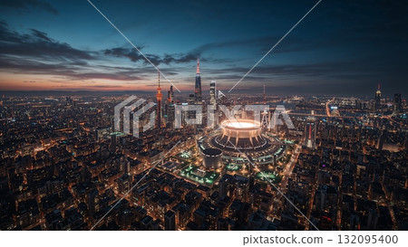 Wide-angle illustration of a futuristic city skyline powered by a large fusion reactor, visible plasma glow in reactor core 132095400