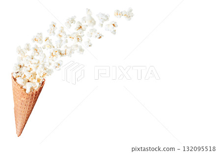 Creative composition of a waffle cone filled with popcorn spilling out, isolated on a transparent background 132095518