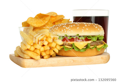 Composition featuring a burger, French fries, potato chips and cola glass arranged on a wooden kitchen board, isolated on a transparent background Composition featuring a burger, French fries, potato chips and cola glass arranged on a wooden kitchen board, isolated on a transparent background 132095560