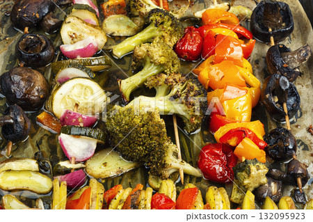 Grilled skewers with vegetables on baking sheet. Grilled skewers with vegetables on baking sheet. 132095923