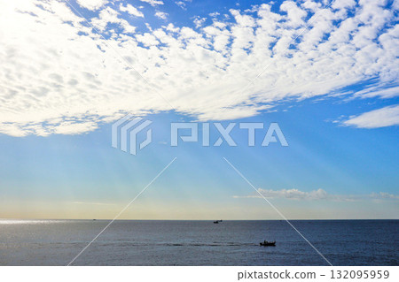 Sagami Bay bathed in crepuscular light and the autumn sky with sheep clouds Sagami Bay bathed in crepuscular light and the autumn sky with sheep clouds 132095959