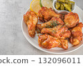 Savor the irresistible allure of these delicious, spicy buffalo chicken wings. Crispy, cooked to perfection and coated in a flavorful sauce, they are sprinkled with sesame seeds 132096011