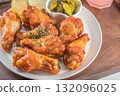 Savor the irresistible allure of these delicious, spicy buffalo chicken wings. Crispy, cooked to perfection and coated in a flavorful sauce, they are sprinkled with sesame seeds 132096025