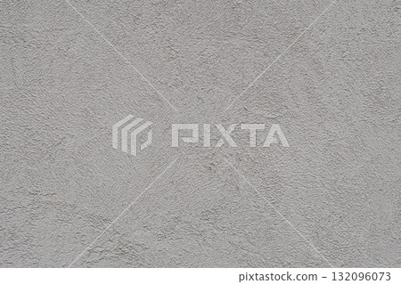 A concrete wall with a beautiful brushed pattern. Gray and rough texture background A concrete wall with a beautiful brushed pattern. Gray and rough texture background 132096073