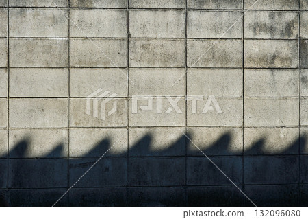 A block wall with a wavy shadow. Block wall texture background A block wall with a wavy shadow. Block wall texture background 132096080