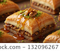 Extreme close-up of a piece of golden Baklava, a traditional Middle Eastern or Mediterranean dessert. 132096267