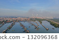 Aerial drone view, beautiful light of north coast of Gresik, Indonesia. Many fishing boats are docking. Aerial drone view, beautiful light of north coast of Gresik, Indonesia. Many fishing boats are docking. 132096368