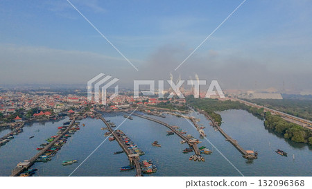 Aerial drone view, beautiful light of north coast of Gresik, Indonesia. Many fishing boats are docking. 132096368