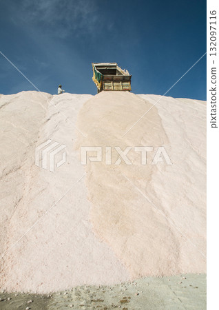 Trucks unloading raw salt bulk, Salinas Grandes de Hidalgo, La Pampa, Argentina. Trucks unloading raw salt bulk, Salinas Grandes de Hidalgo, La Pampa, Argentina. 132097116