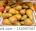 A bountiful collection of fresh, ripe dark yellow pears beautifully nestled in a charming basket, perfect for healthy eating. Close-up. 132097387