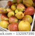 A bountiful collection of fresh, ripe red yellow pears beautifully nestled in a charming basket, perfect for healthy eating. Close-up. 132097390