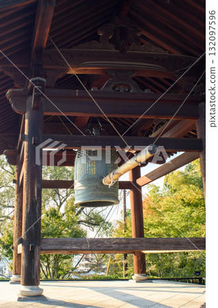 Traditional Japanese temple bell in a wooden structure in Kyoto, Japan Traditional Japanese temple bell in a wooden structure in Kyoto, Japan 132097596