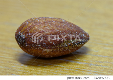 Close-Up of Almond on Wooden Surface Close-Up of Almond on Wooden Surface 132097649