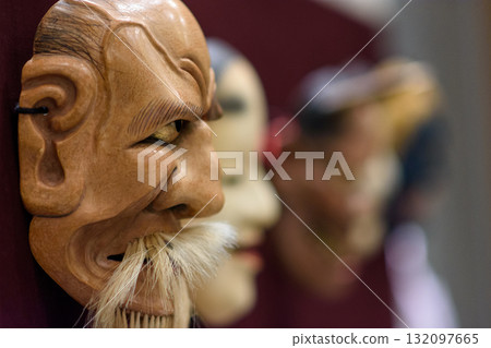 Traditional Japanese Kabuki opera wooden masks on display Traditional Japanese Kabuki opera wooden masks on display 132097665