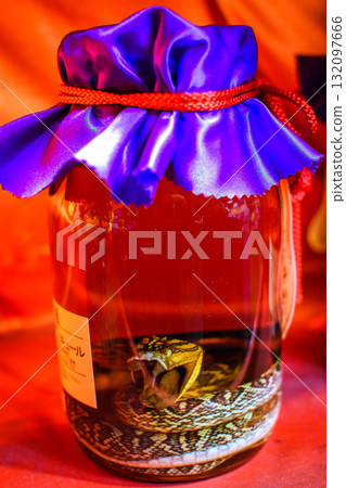 Okinawa snake wine, traditional Okinawan Habushu Habu Sake, made by infusing snake into Awamori rice liquor in Okinawa, Japan Okinawa snake wine, traditional Okinawan Habushu Habu Sake, made by infusing snake into Awamori rice liquor in Okinawa, Japan 132097666