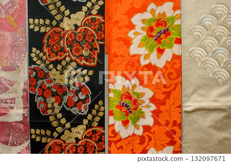 Colorful traditional silk fabrics of Japanese Kimono, featuring floral patterns and intricate designs Colorful traditional silk fabrics of Japanese Kimono, featuring floral patterns and intricate designs 132097671