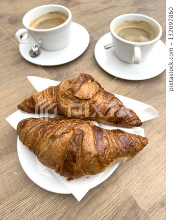 croissants and espresso coffee cups on wooden table in caf croissants and espresso coffee cups on wooden table in caf 132097860