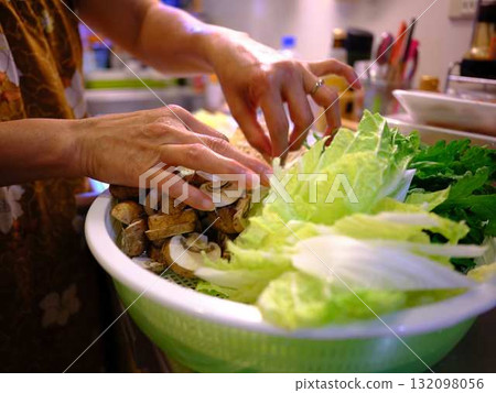 Kitchen cooking vegetables cutting woman hand tags Kitchen cooking vegetables cutting woman hand tags 132098056