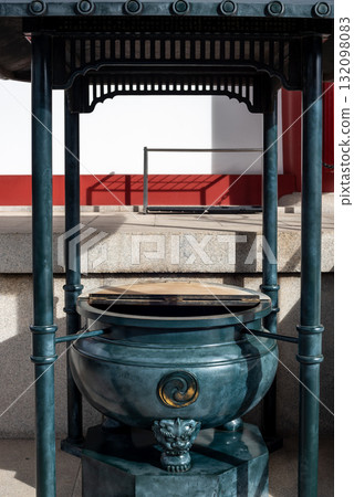 Ornate metal incense burner in traditional setting in Shitennoji Buddhist Temple in Osaka, Japan 132098083