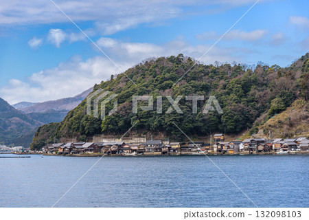 Traditional wooden fishermen Funaya boathouses in Ine, north Kyoto prefecture on the Sea of Japan Traditional wooden fishermen Funaya boathouses in Ine, north Kyoto prefecture on the Sea of Japan 132098103