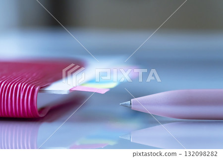 Documents and notebook on the table 132098282