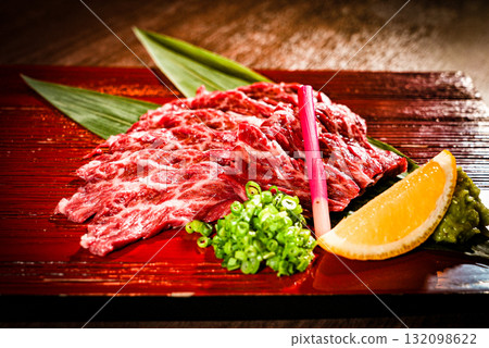 Assorted seared beef served with lemon and condiments Assorted seared beef served with lemon and condiments 132098622