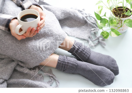 Woman drinking coffee, image of poor circulation Woman drinking coffee, image of poor circulation 132098863