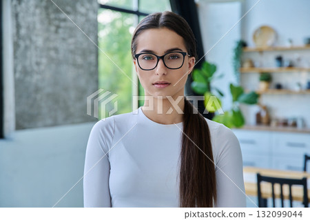 Portrait of serious teenage girl posing at home 132099044