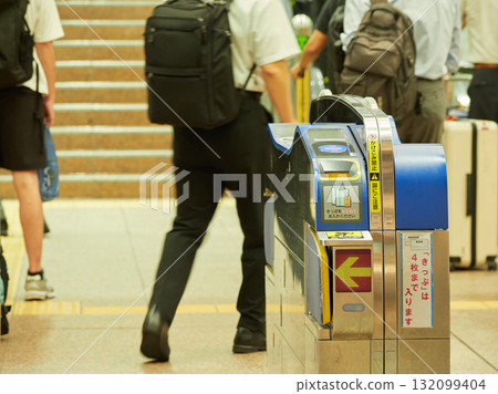 Commuting office workers and foreign tourists passing through the Shinkansen ticket gate at Kanazawa Station 132099404