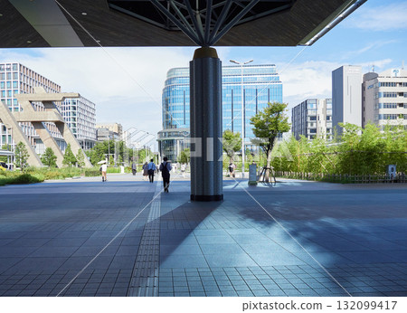 Commuting office workers crossing the west plaza of Kanazawa Station on a summer morning Commuting office workers crossing the west plaza of Kanazawa Station on a summer morning 132099417