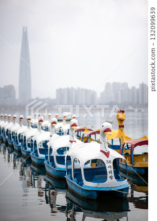 Row of swan-shaped pedal boats on Han River Hangang in Seoul, South Korea Row of swan-shaped pedal boats on Han River Hangang in Seoul, South Korea 132099639