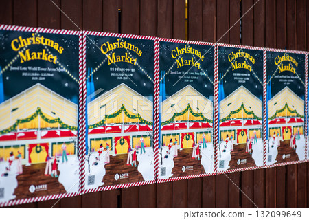 Posters advertising a Christmas market with festive decorations in Seoul, South Korea 132099649