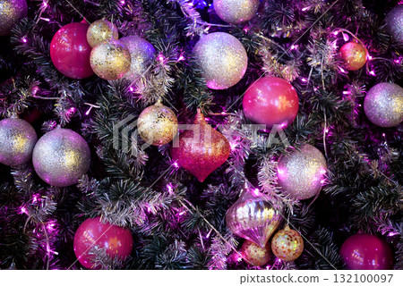 Colorful Baubles and Balls hanging decorated on christmas tree with bokeh light background Colorful Baubles and Balls hanging decorated on christmas tree with bokeh light background 132100097