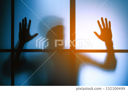silhouette scared man  stand behind glass door , horror background 132100499