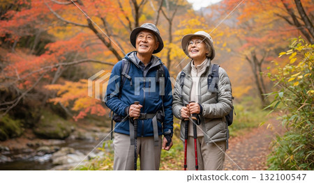 Senior couple hiking in the mountains in autumn Senior couple hiking in the mountains in autumn 132100547