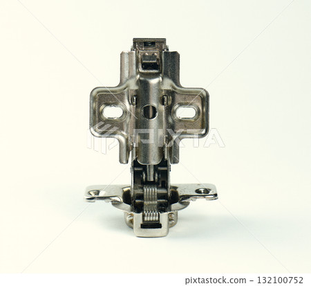 Detailed view of a metal hinge used for cabinets 132100752