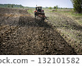 Tractor on the agricultural field 132101582