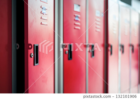 Row of red metal lockers in locker room 132101906