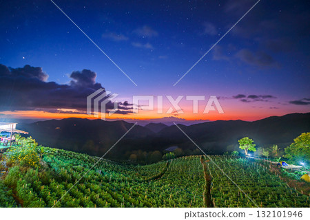 twilight with starry sky on agriculture field mountains landscape twilight with starry sky on agriculture field mountains landscape 132101946