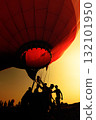 silhouette of people drag hot air balloon with basket at sunset 132101950