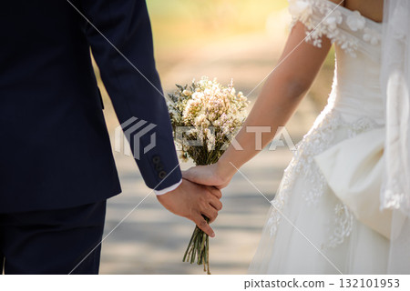 bride and groom in the park 132101953