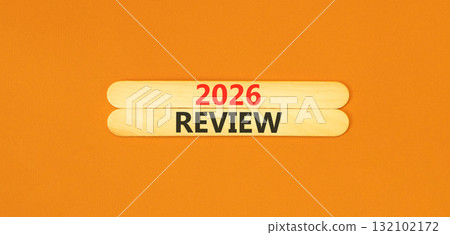 2026 Review symbol. Concept words 2026 Review on beautiful wooden sticks. Beautiful orange paper background. Business and 2026 review concept. Copy space. 132102172