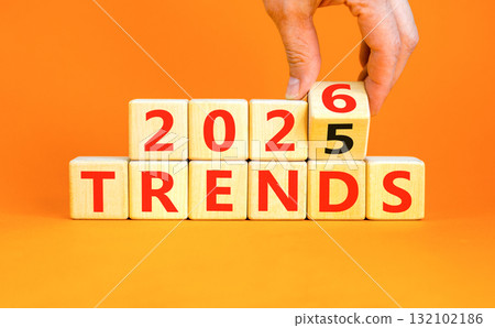 2026 Trends new year symbol. Concept words 2026 Trends on beautiful wooden blocks. Beautiful orange paper background. Businessman's hand. Business and 2026 Trends new year concept. Copy space. 2026 Trends new year symbol. Concept words 2026 Trends on beautiful wooden blocks. Beautiful orange paper background. Businessman's hand. Business and 2026 Trends new year concept. Copy space. 132102186