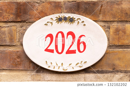 Business concept of 2026 new year symbol. Concept number 2026 Happy new year on beautiful white road sign. Beautiful old brown brick wall background. Business 2026 happy new year concept. Copy space. Business concept of 2026 new year symbol. Concept number 2026 Happy new year on beautiful white road sign. Beautiful old brown brick wall background. Business 2026 happy new year concept. Copy space. 132102202