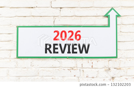 2026 Review symbol. Concept words 2026 Review on beautiful white sign with arrow. Beautiful old white brick wall background. Business and 2026 review concept. Copy space. 2026 Review symbol. Concept words 2026 Review on beautiful white sign with arrow. Beautiful old white brick wall background. Business and 2026 review concept. Copy space. 132102203