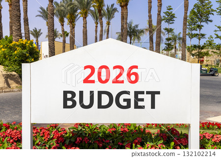 2026 Budget symbol. Concept words 2026 Budget on beautiful white road sign. Beautiful palm trees palm-trees and blue sky background. Business and 2026 budget concept. Copy space. 2026 Budget symbol. Concept words 2026 Budget on beautiful white road sign. Beautiful palm trees palm-trees and blue sky background. Business and 2026 budget concept. Copy space. 132102214